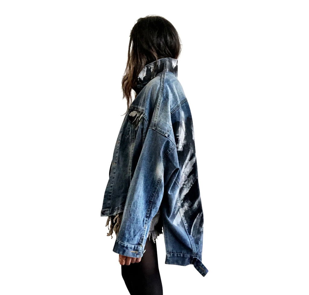 Dark blue denim jacket with long back. White and black pattern painted on back, with ART SCHOOL DROPOUT painted over it in white. Collar and front pockets painted with black and white pattern. Signed @wrenandglory.