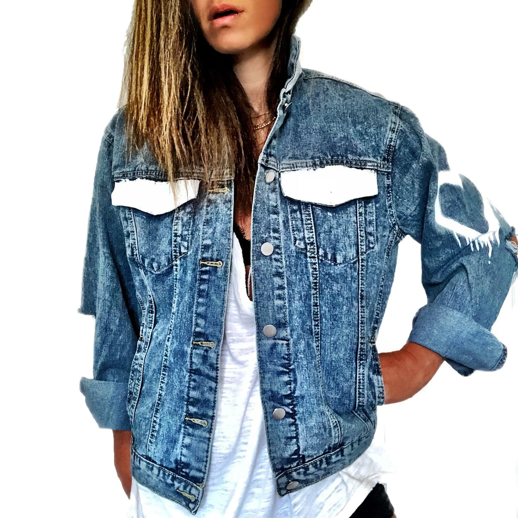 Medium blue denim wash. 'I Love You' painted in rainbow cursive, over and over. White painted pockets and collar, with dripping heart on arm. Signed @wrenandglory.