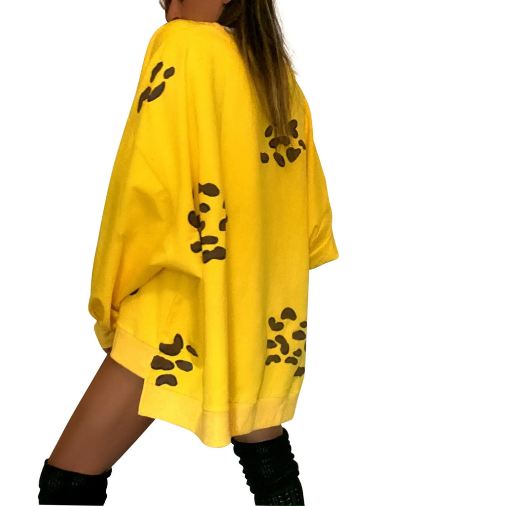 Oversized yellow crewneck sweatshirt. Cheetah pattern painted throughout in brown and black. Signed @wrenandglory.