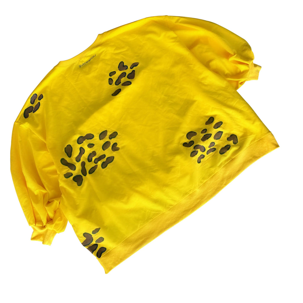 Oversized yellow crewneck sweatshirt. Cheetah pattern painted throughout in brown and black. Signed @wrenandglory.