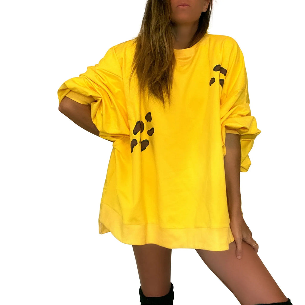 Oversized yellow crewneck sweatshirt. Cheetah pattern painted throughout in brown and black. Signed @wrenandglory.