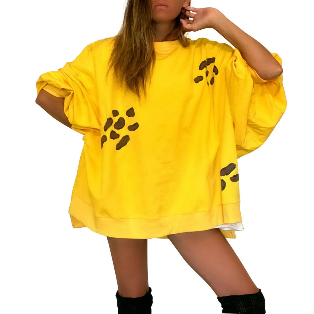 Oversized yellow crewneck sweatshirt. Cheetah pattern painted throughout in brown and black. Signed @wrenandglory.