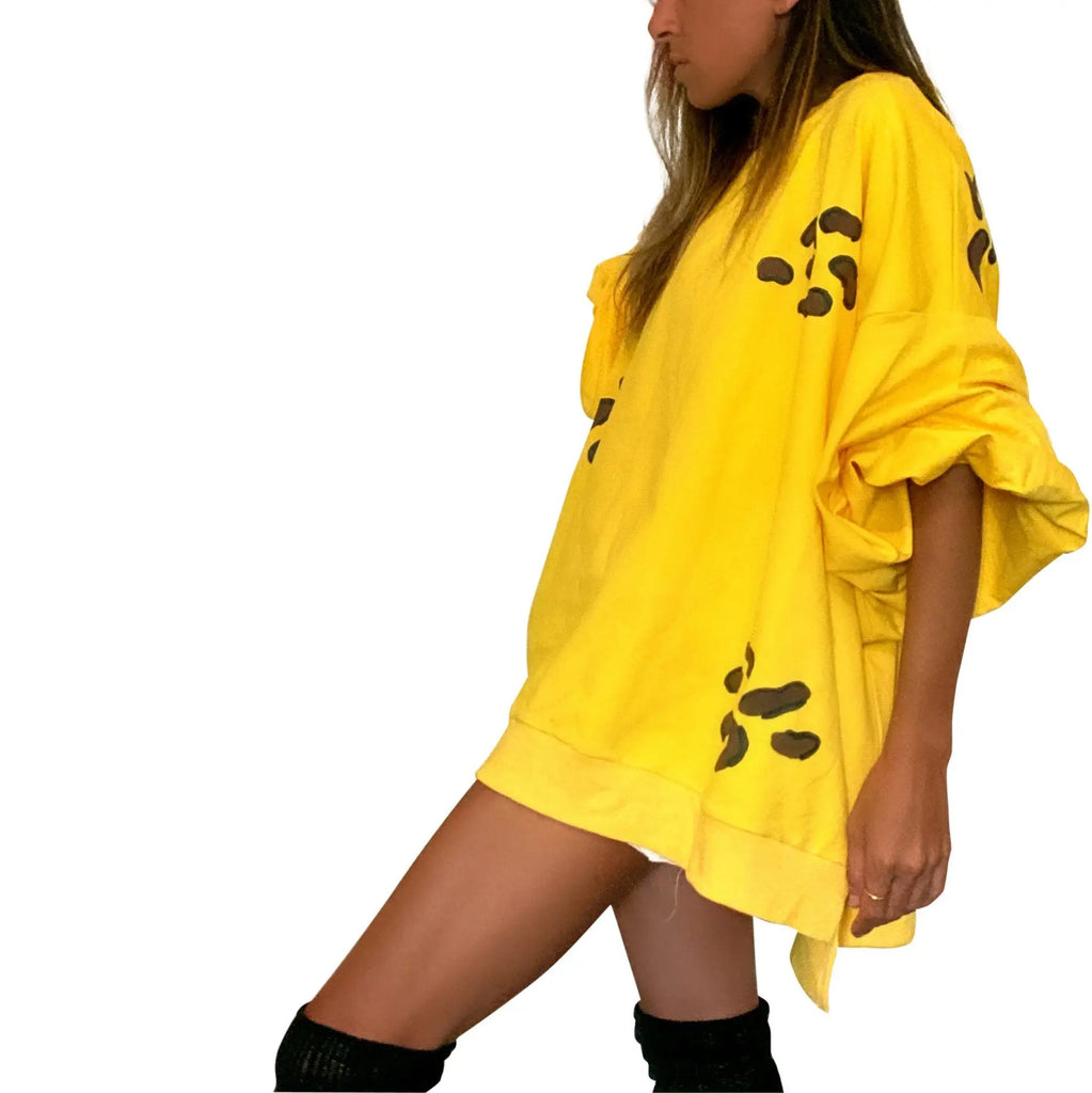 Oversized yellow crewneck sweatshirt. Cheetah pattern painted throughout in brown and black. Signed @wrenandglory.