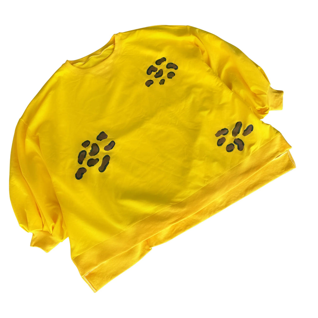 Oversized yellow crewneck sweatshirt. Cheetah pattern painted throughout in brown and black. Signed @wrenandglory.
