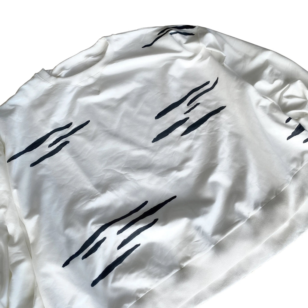 Oversized white crewneck sweatshirt. Zebra pattern painted throughout in black. Signed @wrenandglory.